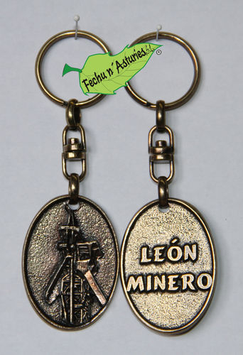 Llavero castillete con trasera "LEÓN MINERO" acabado en latón envejecido y embolsado en plástico.
