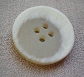 Pale stone button