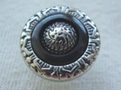 Silver effect dyed inlay button