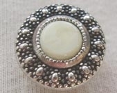Metal button with marble effect centre
