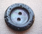 Black kaleidoscope button